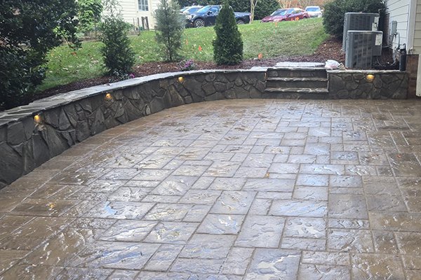 Completed stone patio project by Alpha Tree Services